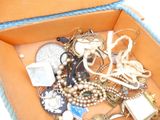 a box full of jewelry that is sitting on a table