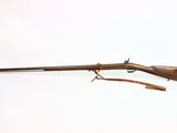 an old rifle with a wooden handle and a wooden handle