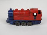 a red and blue toy train on a white surface