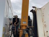 a truck with a crane attached to the back of it