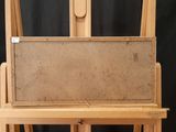 a picture of a wooden easel with a painting on it