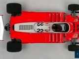 the top view of a red race car on a white surface