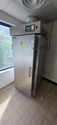 an image of a stainless steel refrigerator in a room