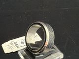 a ring that is sitting on top of a piece of glass