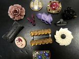many different types of brooches on a table