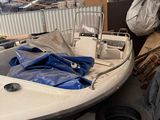 a boat that is sitting on the ground in a warehouse