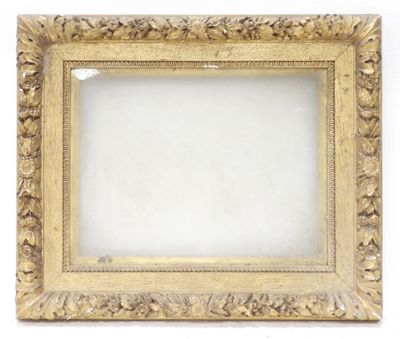 an antique gold frame with a white background