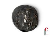 an ancient coin with a man on a horse and a woman on a horse