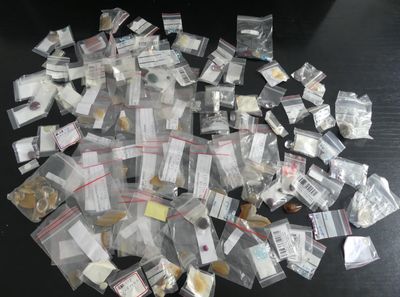 a pile of small packages on a black table