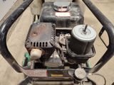 a close up of a small engine on a cart