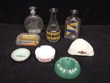 many different types of liquor bottles on a black table