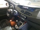 a car dashboard with a steering wheel and a dash light