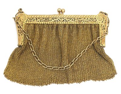 a gold chain purse with a chain around it