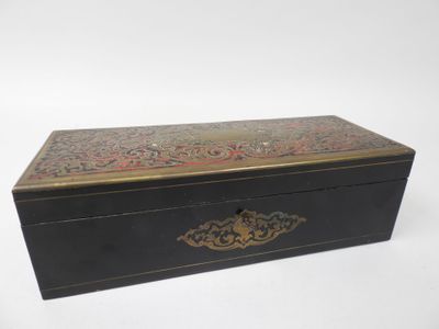 an image of a black box with a gold and red design on it