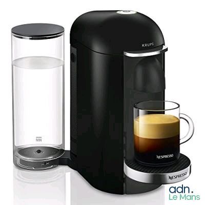 an image of a black coffee maker next to a glass of water