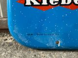 a close up of a pepsi sign on the side of a building