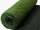 a roll of artificial grass on top of a black mat