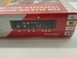 a box with a remote on it sitting on a table
