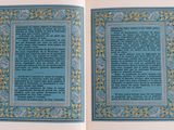 an open book with a blue cover and a yellow border on it