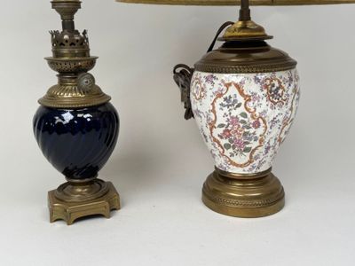 two lamps sitting next to each other on a table