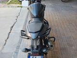 a motorcycle that is parked on the side of the street