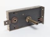 a door lock with a key on it on a white surface