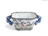 a white bowl with a blue handle and a bird on it