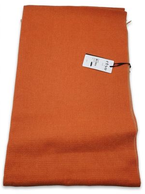 a close up of an orange fabric with a tag on it
