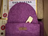 a purple hat that is sitting in a box