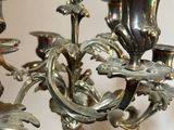 a silver candelier that is sitting on a table