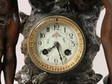 a clock that is sitting on top of a statue