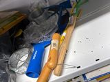 a close up of a cluttered shelf with tools on it