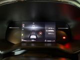 the dashboard of a car with a digital display on it ' s display screen