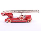 a red toy fire truck with a ladder on top of it