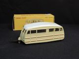 a toy bus that is sitting next to a box