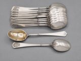 five spoons and two spoons sitting on a table