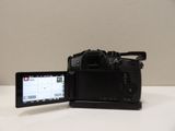 a camera and a tablet sitting on a table