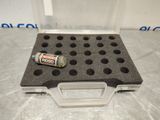 a close up of a plastic case with a can of soda in it