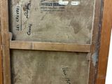 a picture of an old wooden picture frame on a table