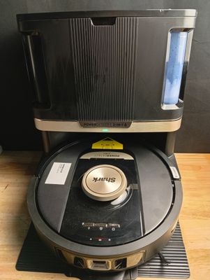 an image of a robotic vacuum cleaner sitting on top of a wooden floor