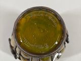 an image of a close up of a ring with a green liquid