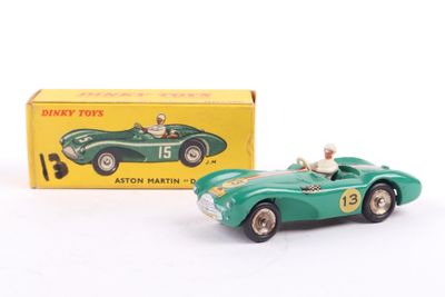 an image of a green toy car with a box in the background