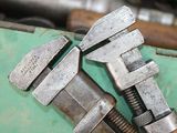 two wrenes that are sitting on top of a piece of metal