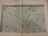 map of the city of london in a book opened to show a map of the city