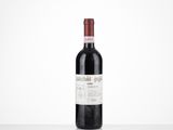 the bottle of red wine is sitting on the table