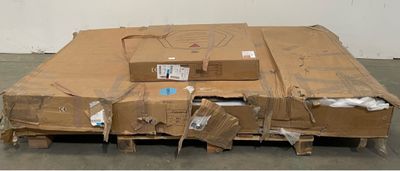 a cardboard box sitting on top of a pallet in a warehouse