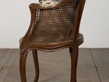 a wooden chair with a cushion on top of it