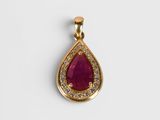 an image of a ruby and diamond pendant on a white background