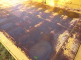 a yellow truck that has rust on the side of it