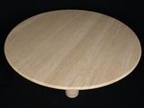 a small wooden table with a black background